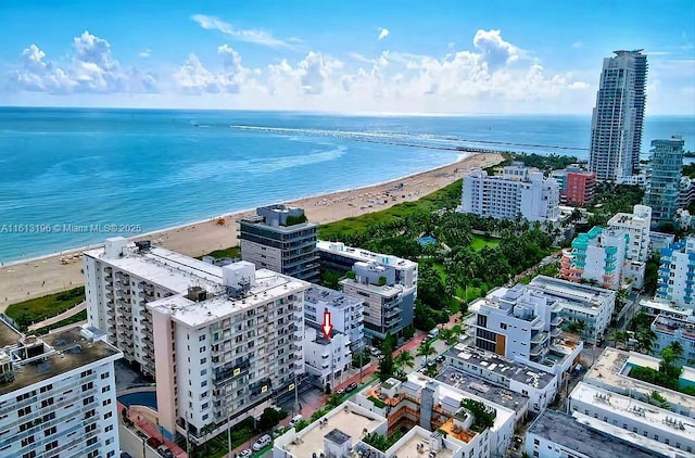 aerial view featuring a view of the beach and a water view