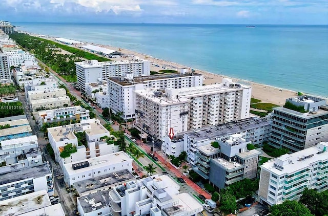 bird's eye view featuring a beach view and a water view