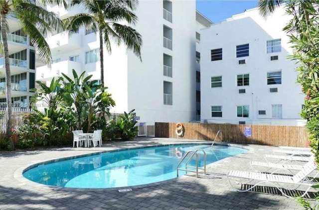 view of swimming pool with a patio