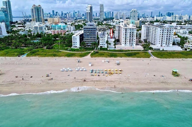 aerial view featuring a water view and a beach view