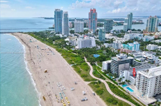 bird's eye view with a beach view and a water view