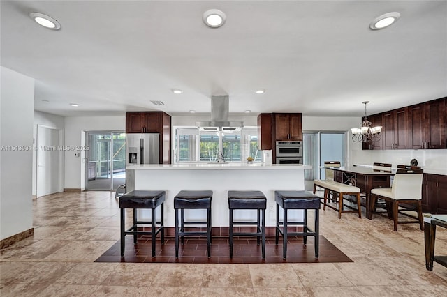 kitchen with light countertops, appliances with stainless steel finishes, and a center island