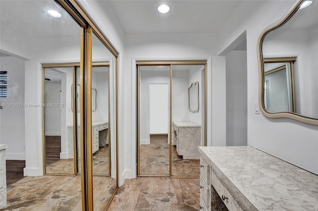 bathroom featuring recessed lighting and vanity