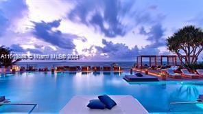 view of pool with a water view