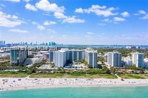 bird's eye view with a beach view and a water view