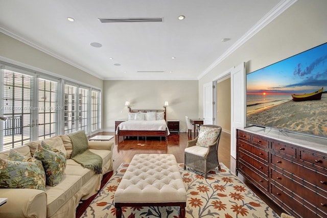 bedroom featuring light hardwood / wood-style floors and ornamental molding