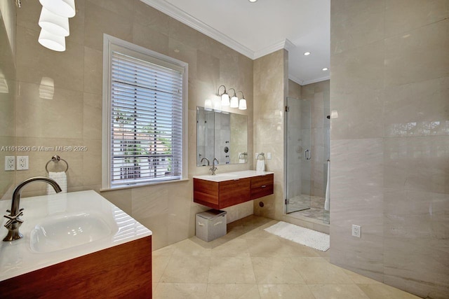 bathroom featuring crown molding, tile walls, vanity, and walk in shower