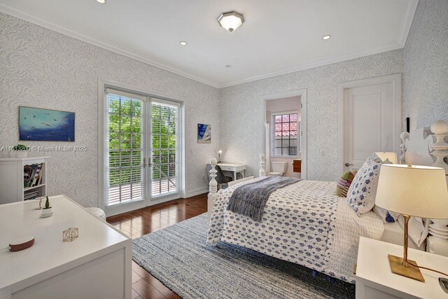 bedroom featuring access to exterior, ornamental molding, and dark hardwood / wood-style floors