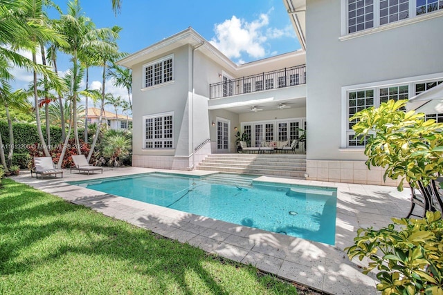 view of pool with ceiling fan and a patio area