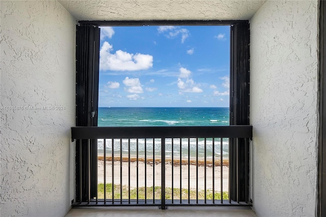 property view of water featuring a beach view