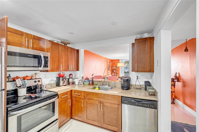 kitchen with light tile patterned flooring, sink, and stainless steel appliances