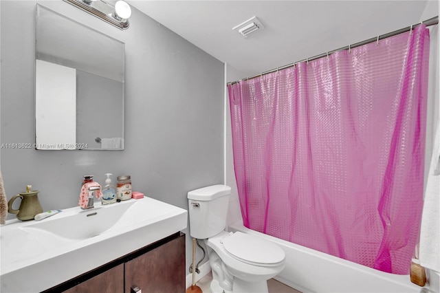 full bathroom featuring shower / bath combination with curtain, toilet, and vanity