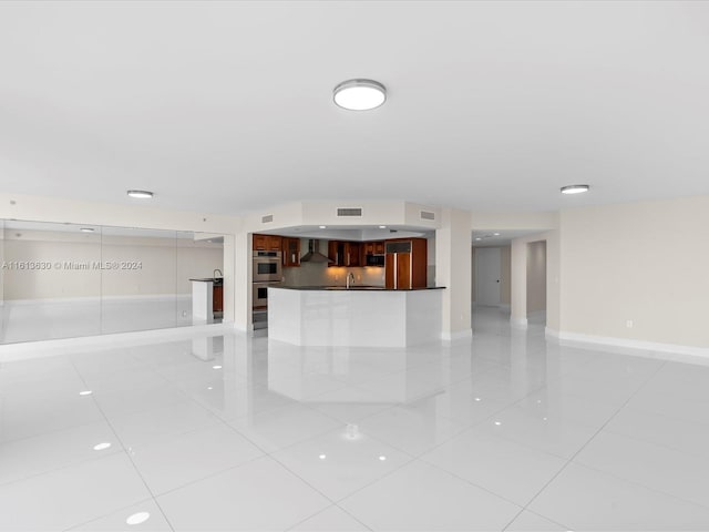 unfurnished living room featuring light tile patterned flooring