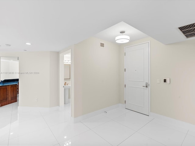 corridor with light tile patterned floors