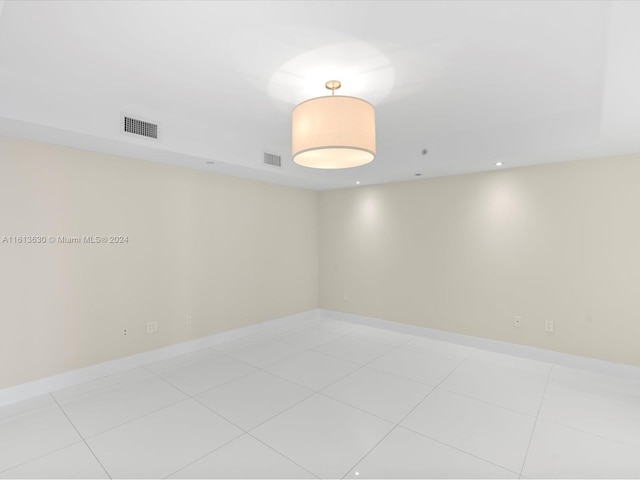 spare room with light tile patterned floors