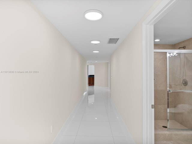 hallway with light tile patterned floors