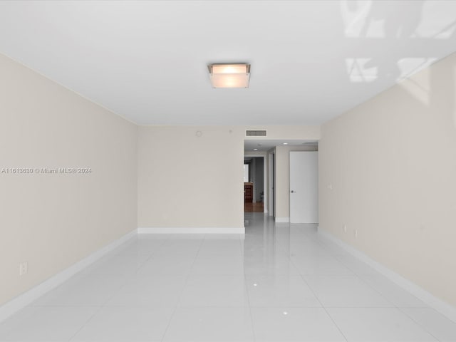 empty room with light tile patterned flooring