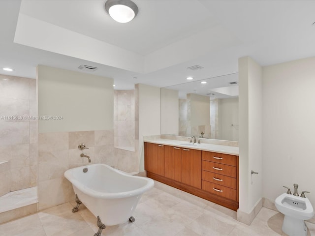 bathroom featuring tile patterned floors, separate shower and tub, a bidet, vanity, and tile walls