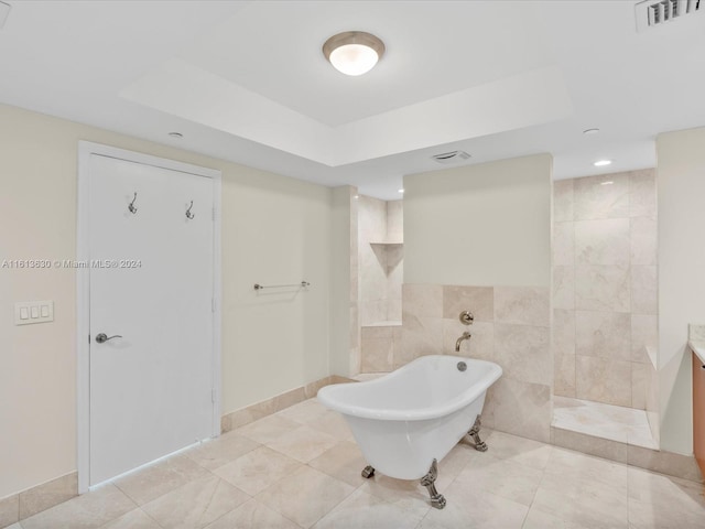 bathroom featuring tile walls and independent shower and bath