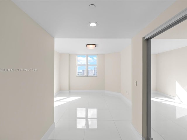 empty room with light tile patterned floors