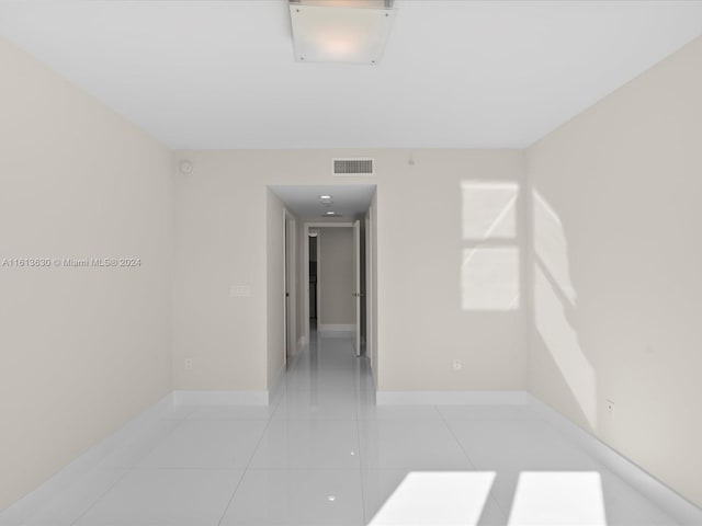 empty room with light tile patterned floors