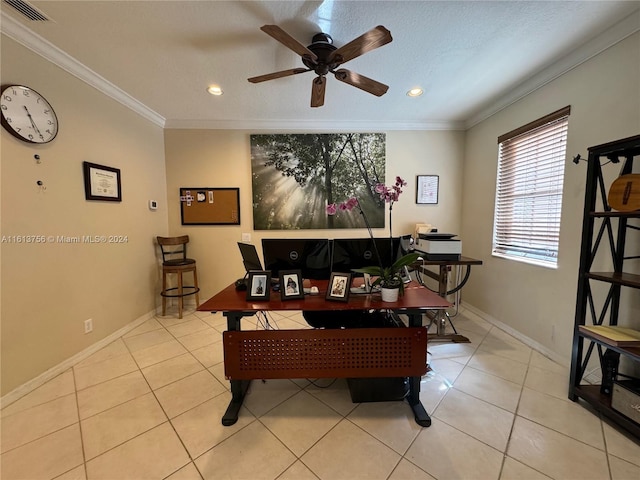 tiled dining space featuring ornamental molding and ceiling fan