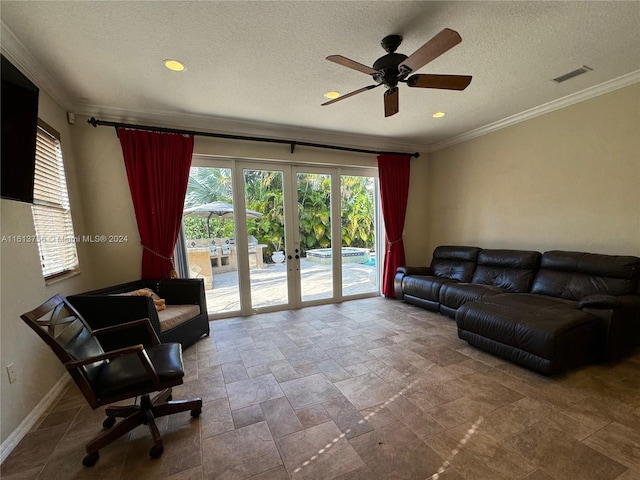 tiled living room with french doors, ceiling fan, ornamental molding, and a textured ceiling