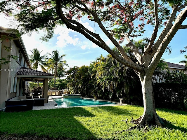 view of pool featuring a yard