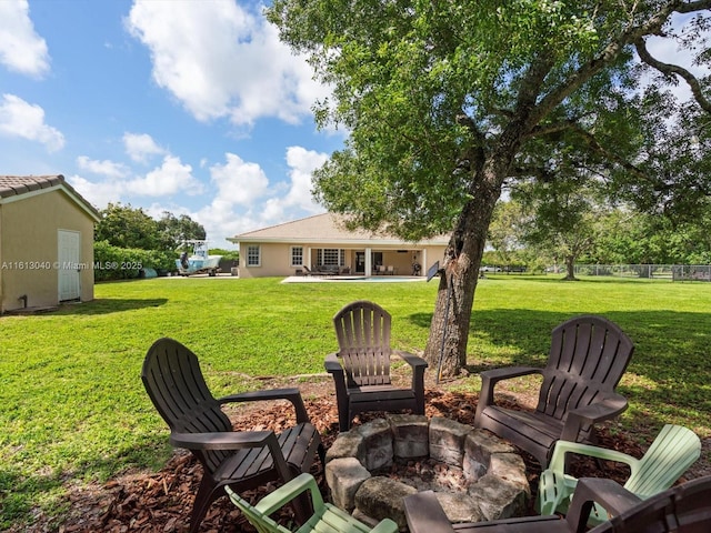 view of yard featuring a patio and a fire pit