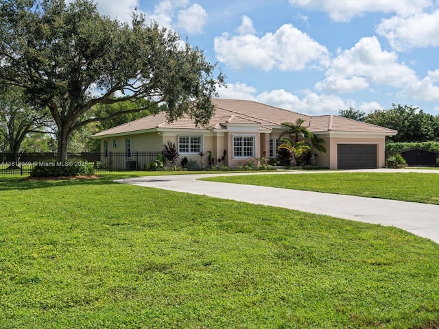 view of front of home with a garage and a front yard