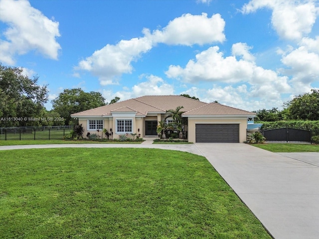 view of front of house featuring a garage and a front yard