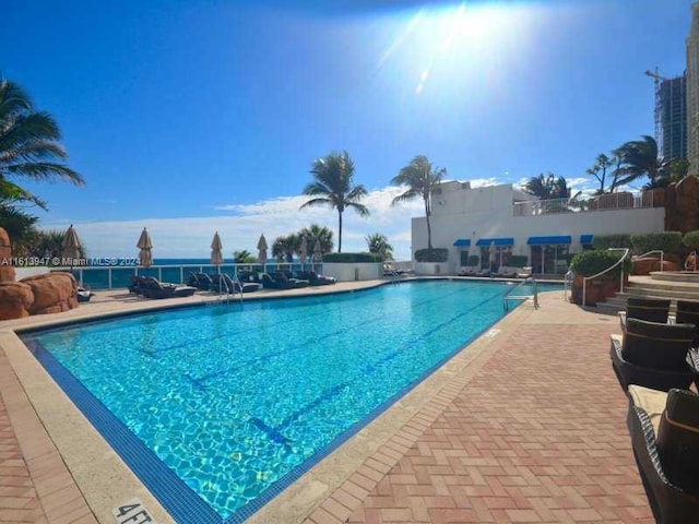 view of pool featuring a patio area