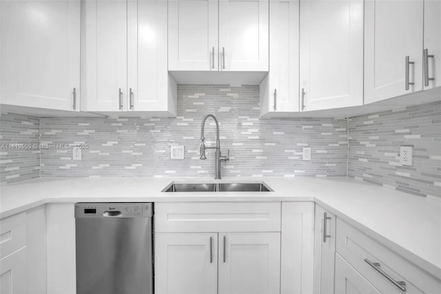 kitchen featuring white cabinetry, sink, and stainless steel dishwasher