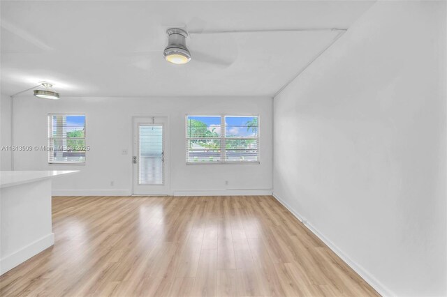 spare room with ceiling fan and light hardwood / wood-style flooring