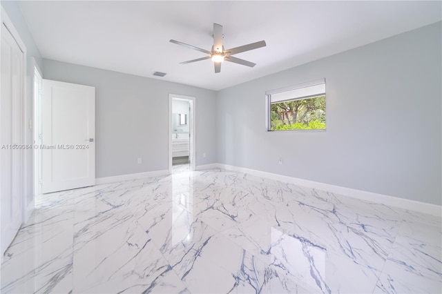 spare room with ceiling fan