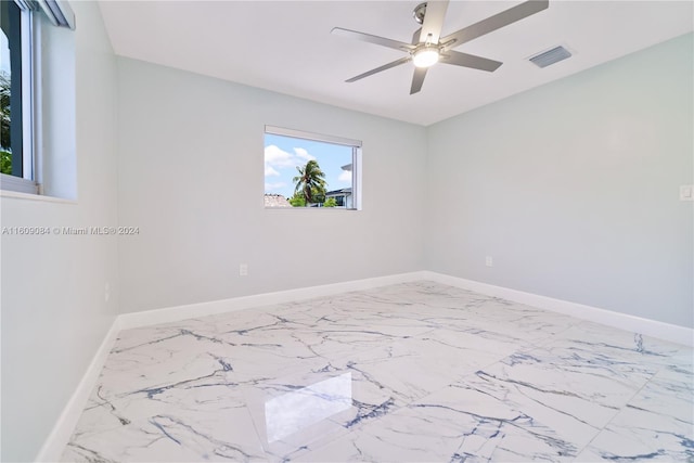 unfurnished room with ceiling fan