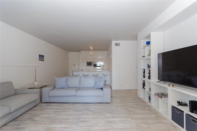 living room with light hardwood / wood-style flooring