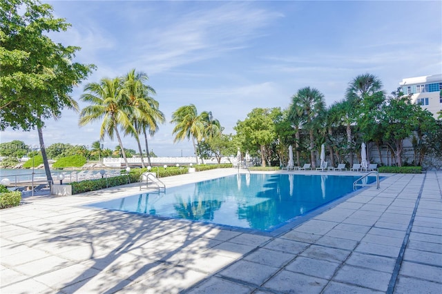 view of swimming pool with a patio area