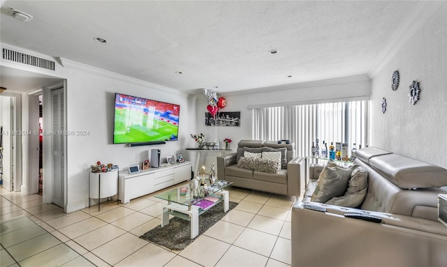 tiled living room with a textured ceiling and ornamental molding