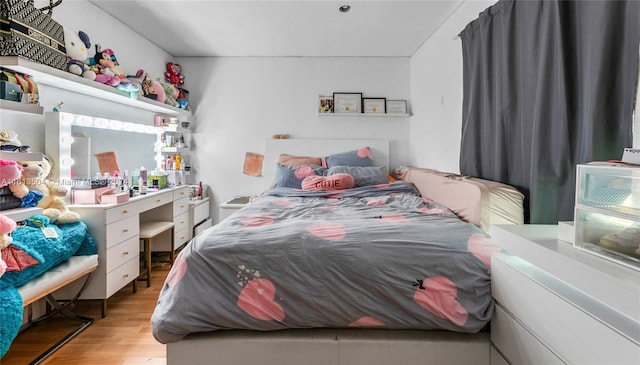 bedroom with light hardwood / wood-style flooring