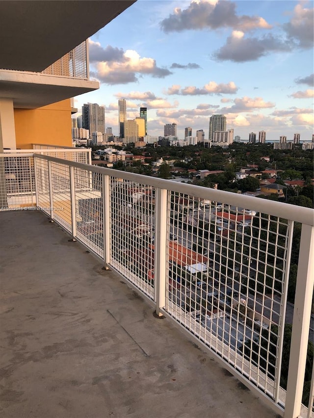 view of balcony at dusk