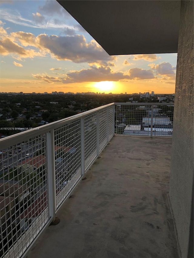 view of balcony at dusk