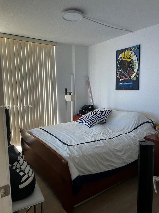 bedroom featuring hardwood / wood-style flooring