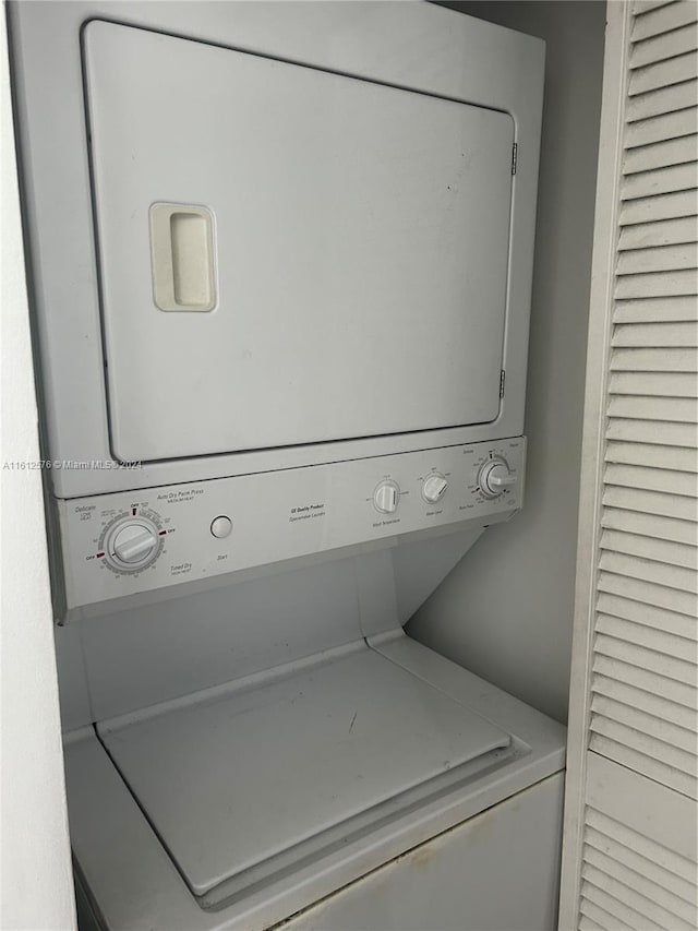 laundry room featuring stacked washer and dryer