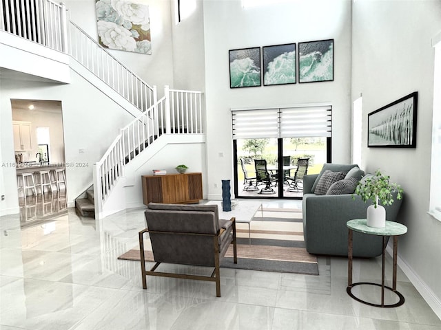 living room featuring a high ceiling