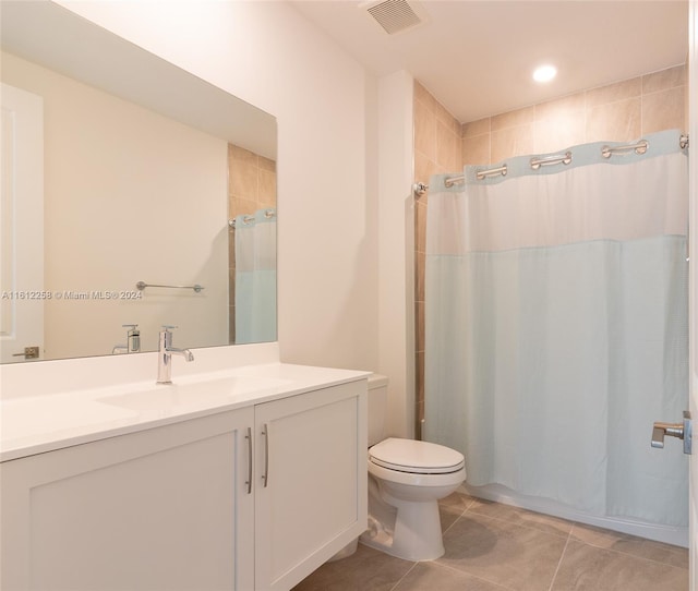 bathroom featuring tile patterned floors, vanity, toilet, and a shower with curtain