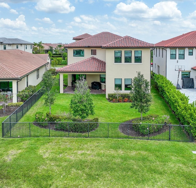 back of house with a yard