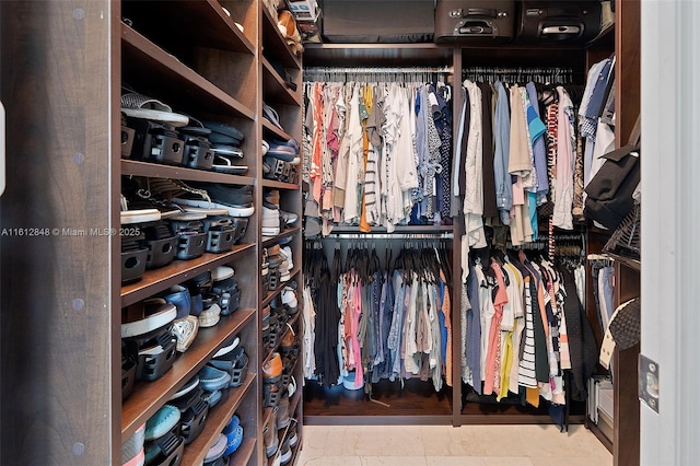 spacious closet with tile patterned flooring