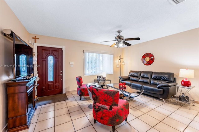 living room featuring ceiling fan and light tile patterned floors