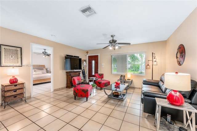 living room with light tile patterned floors and ceiling fan